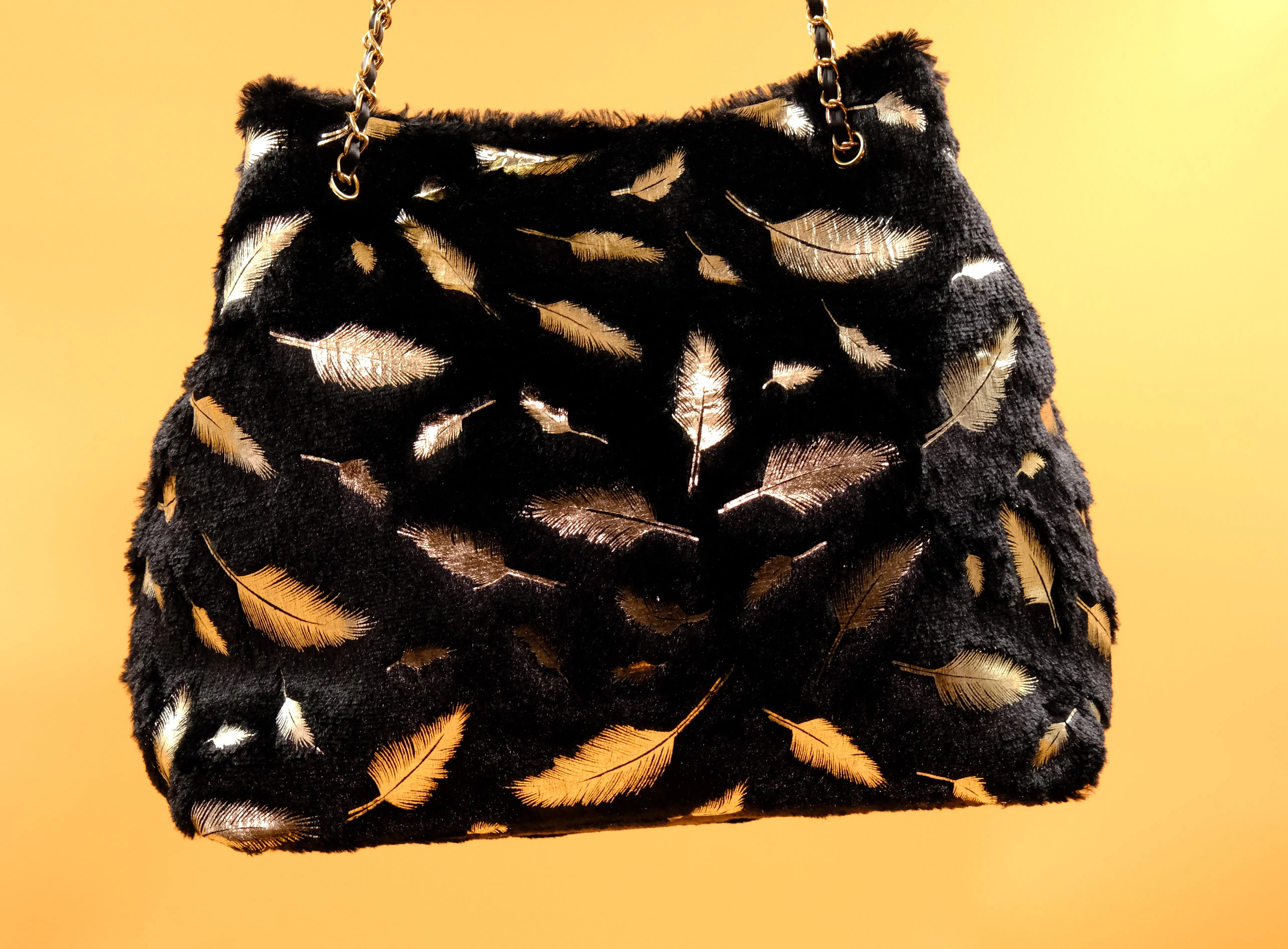 Elegant Black Faux Fur Tote Bag with Gold Feather Accents