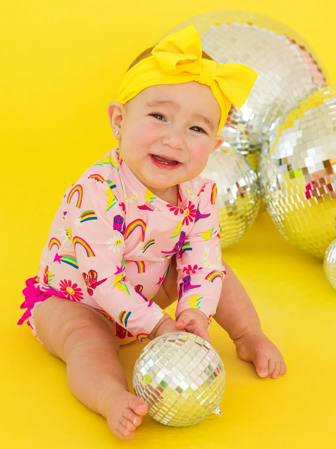 RuffleButts Baby Girls UPF 50  Sun Protection Novelty Print Long Sleeve One Piece Rash Guard Swimsuit with Zipper