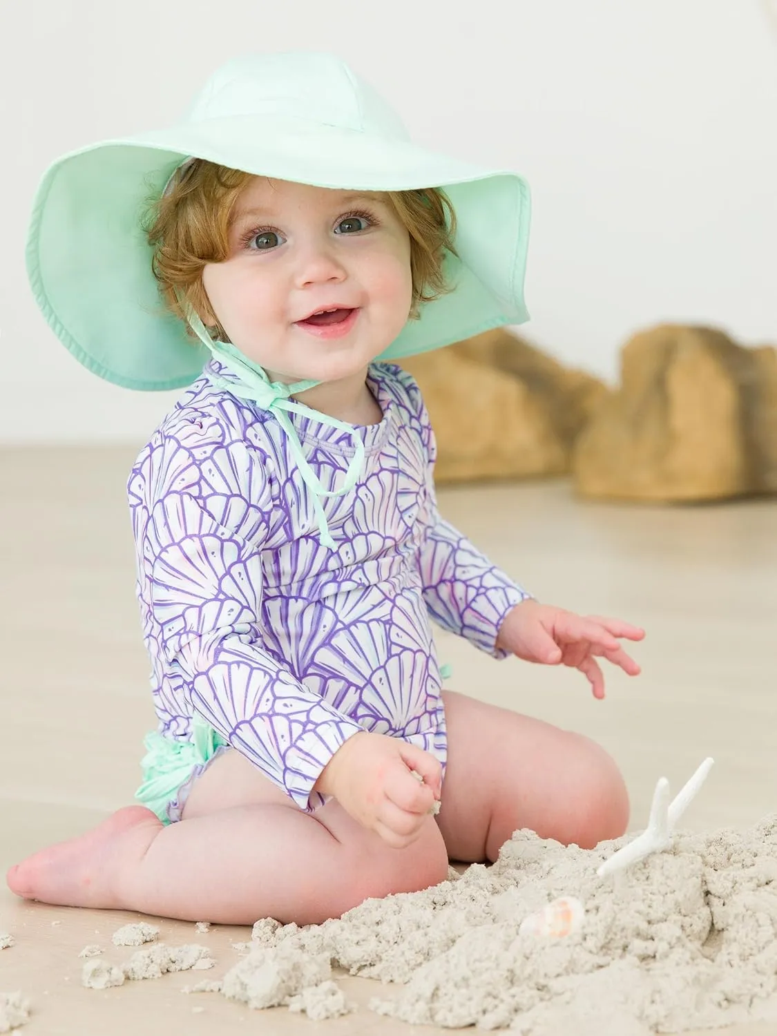 RuffleButts Baby Girls UPF 50  Sun Protection Novelty Print Long Sleeve One Piece Rash Guard Swimsuit with Zipper