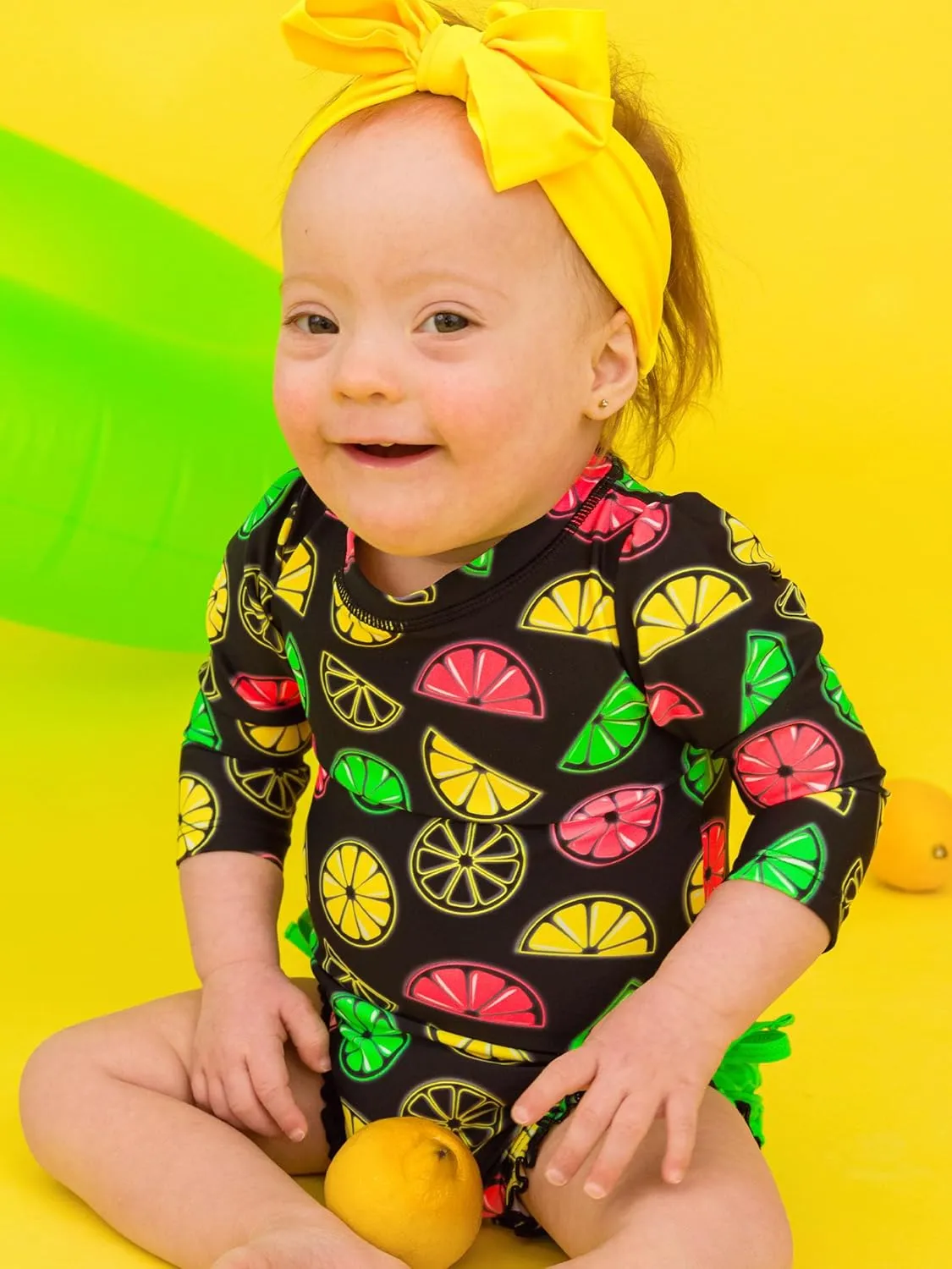 RuffleButts Baby Girls UPF 50  Sun Protection Novelty Print Long Sleeve One Piece Rash Guard Swimsuit with Zipper