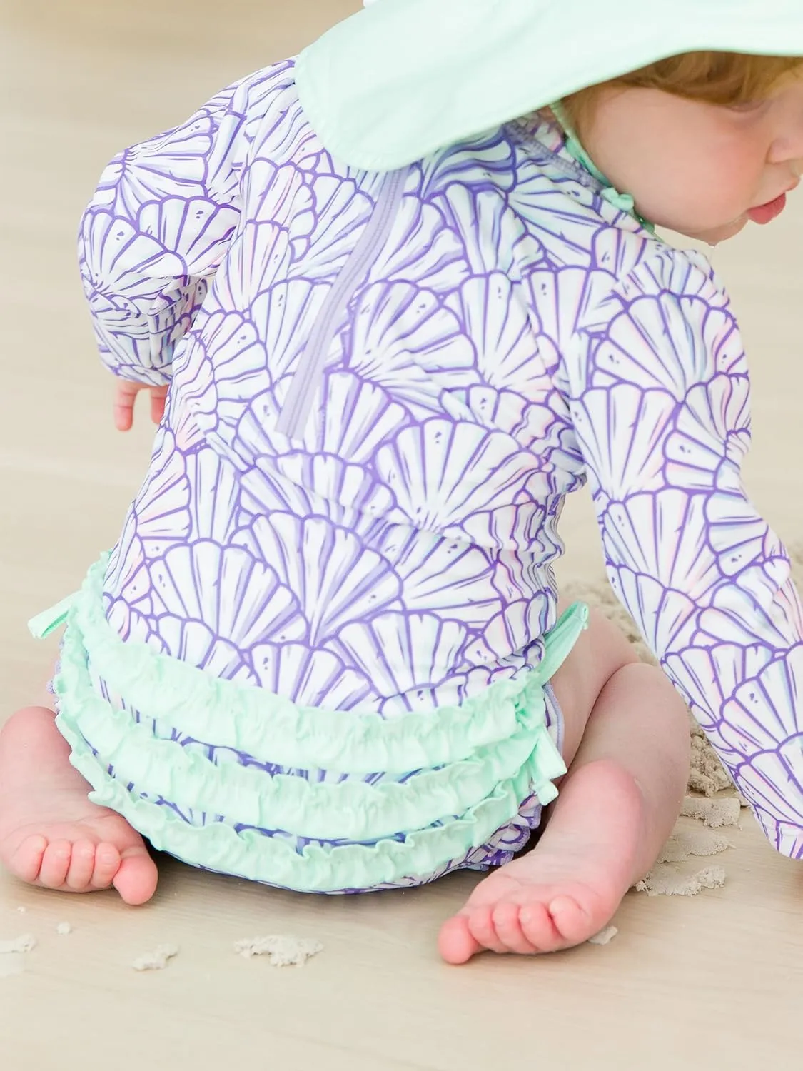 RuffleButts Baby Girls UPF 50  Sun Protection Novelty Print Long Sleeve One Piece Rash Guard Swimsuit with Zipper