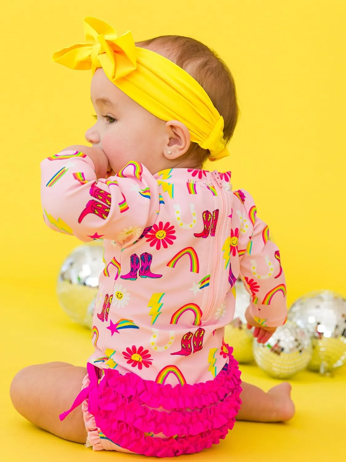 RuffleButts Baby Girls UPF 50  Sun Protection Novelty Print Long Sleeve One Piece Rash Guard Swimsuit with Zipper