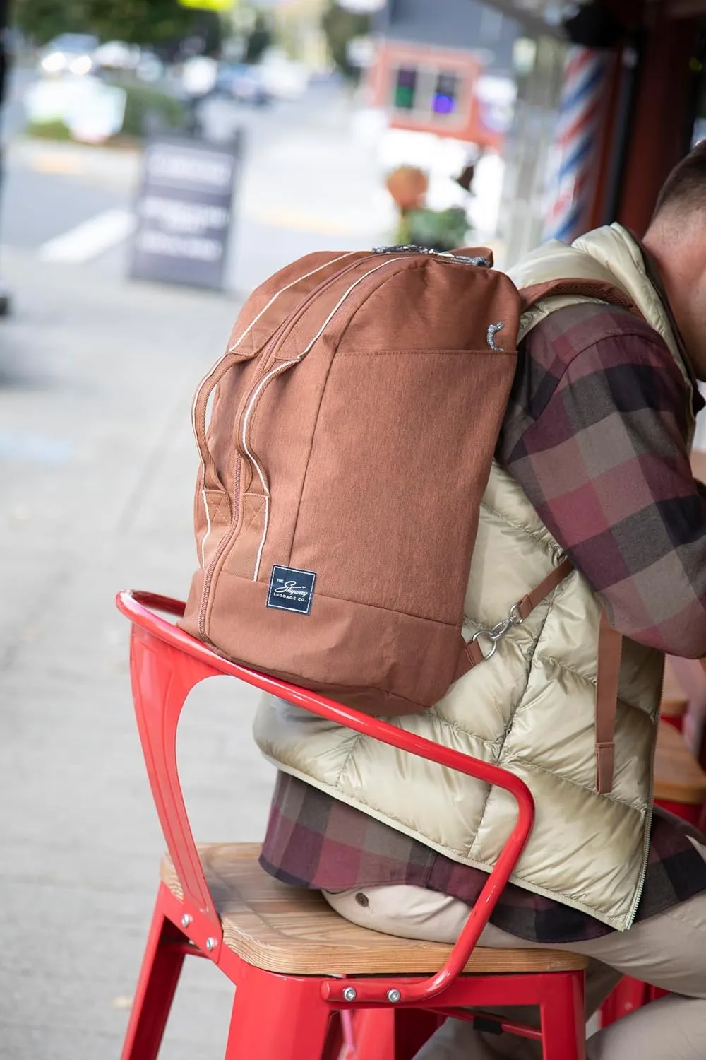 Skyway Luggage Rainier Compact Duffel Backpack, Eco-Friendly, Made of 100% rPET Travel Laptop Bag for Women & Men, Flight Approved Carry On Bag, 30L, Moab Red